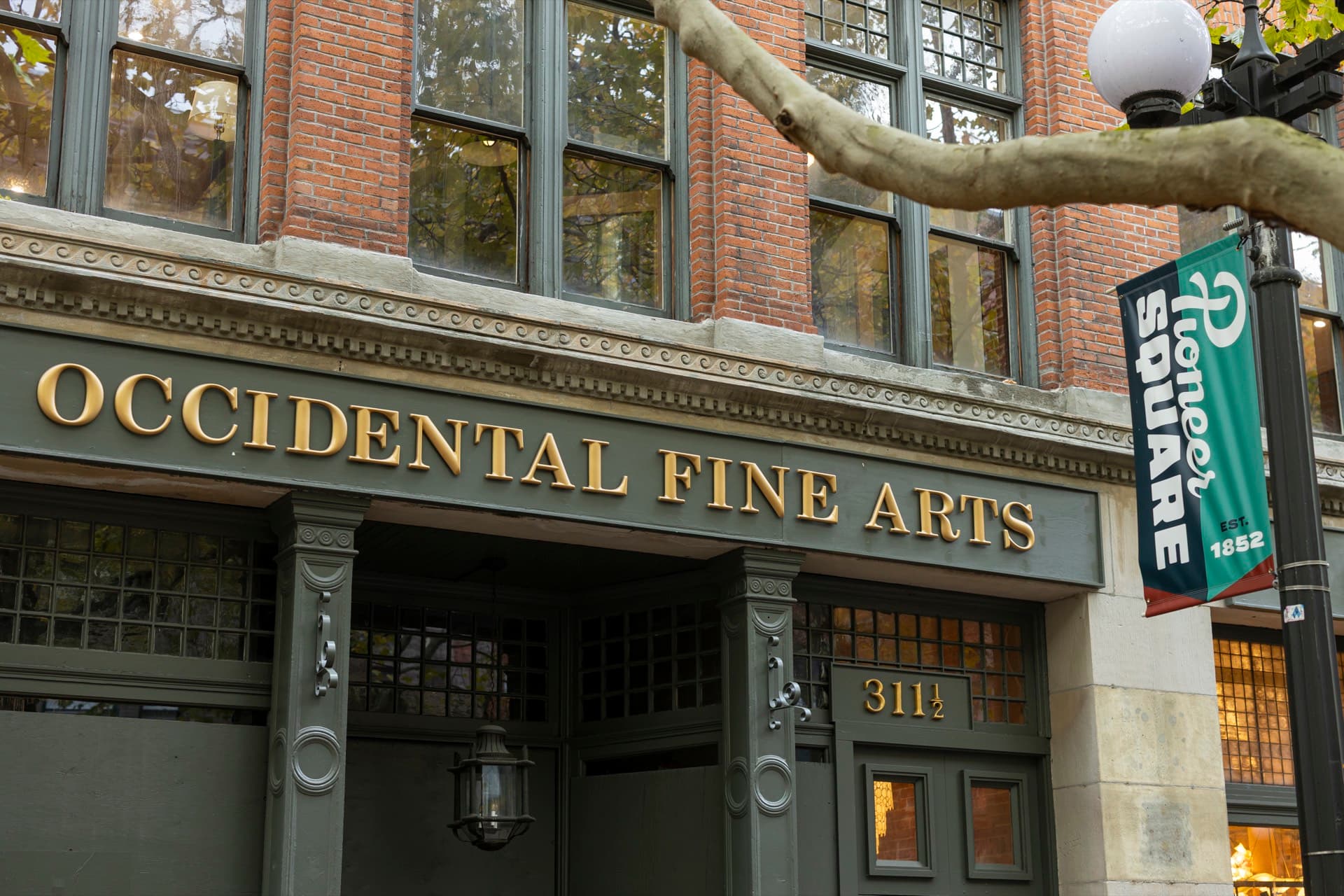 Inside the Occidental Fine Arts Center. Restored brick walls, tall windows, and gallery space ready for live performance